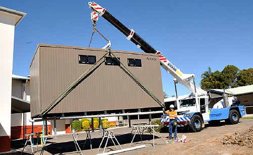 LOO WITH A VIEW: Adam Salmon, of Wide Bay Crane Hire, supervises as new women’s toilets are installed before the Muster Race Day at Gympie Turf Club. LOO WITH A VIEW: Adam Salmon, of Wide Bay Crane Hire, supervises as new women’s toilets are installed before the Muster Race Day at Gympie Turf Club.